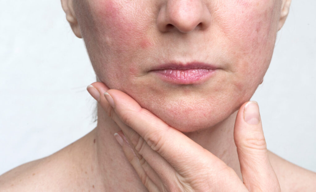 Happy woman, beauty or skincare with orange for citrus detox or vitamin C on a white studio background. Female person, model or smile with natural organic fruit for healthy skin or nutrition on space